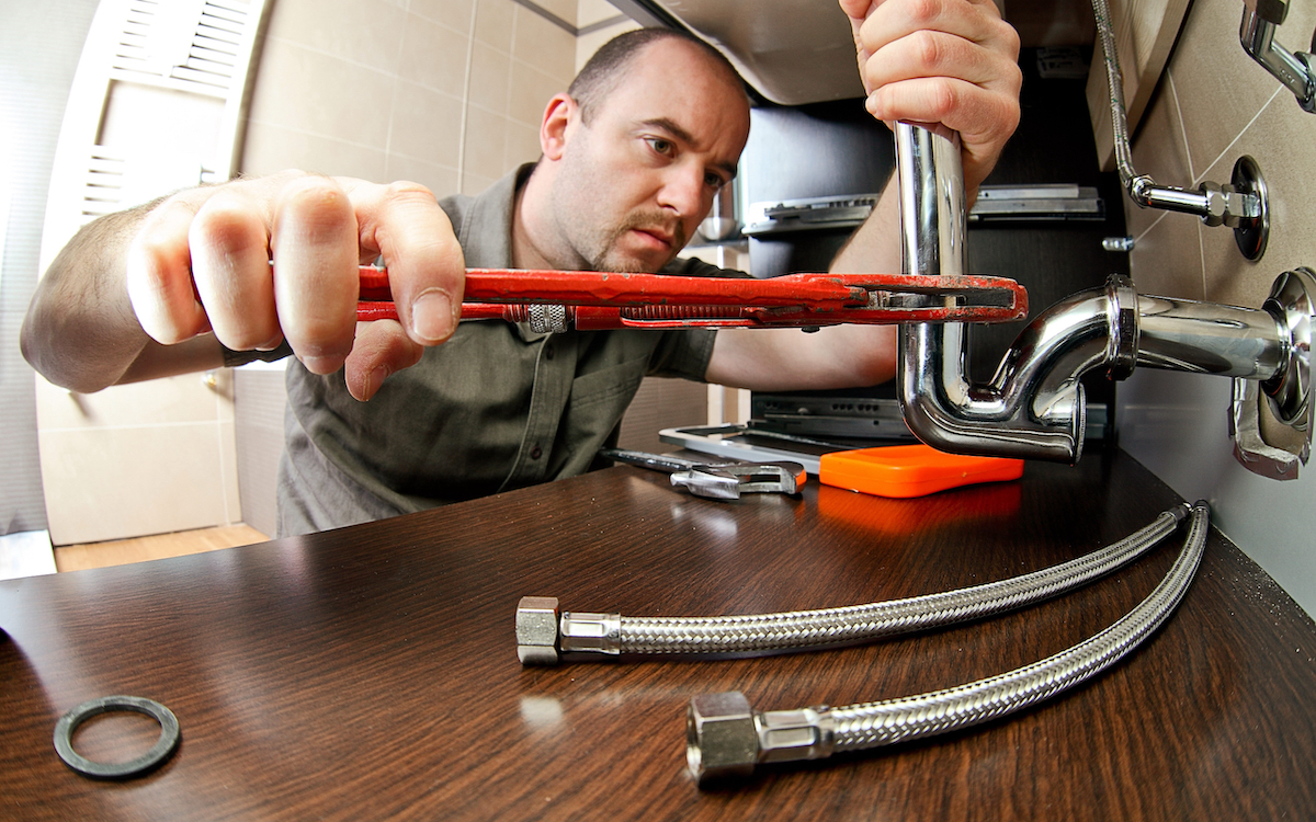 Master plumber with tools